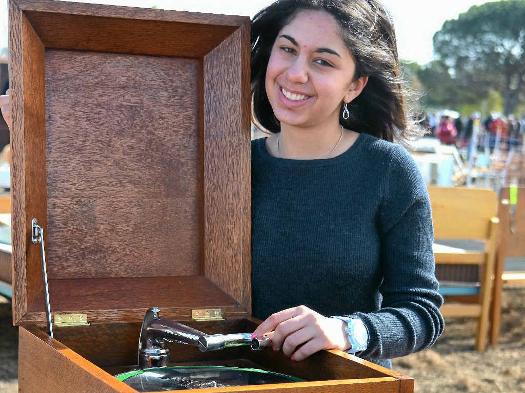 SAVING THE BIG BUCKS: Amelia Kousary was optimistic she would snag this record player for her growing music collection at yesterday’s auction. SAVING THE BIG BUCKS: Amelia Kousary was optimistic she would snag this record player for her growing music collection at yesterday’s auction.